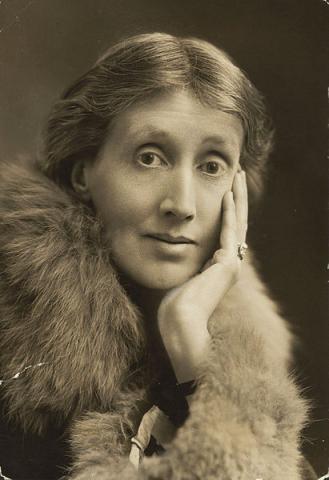 Photograph of Virginia Woolf with hand on face wearing a fur stole 